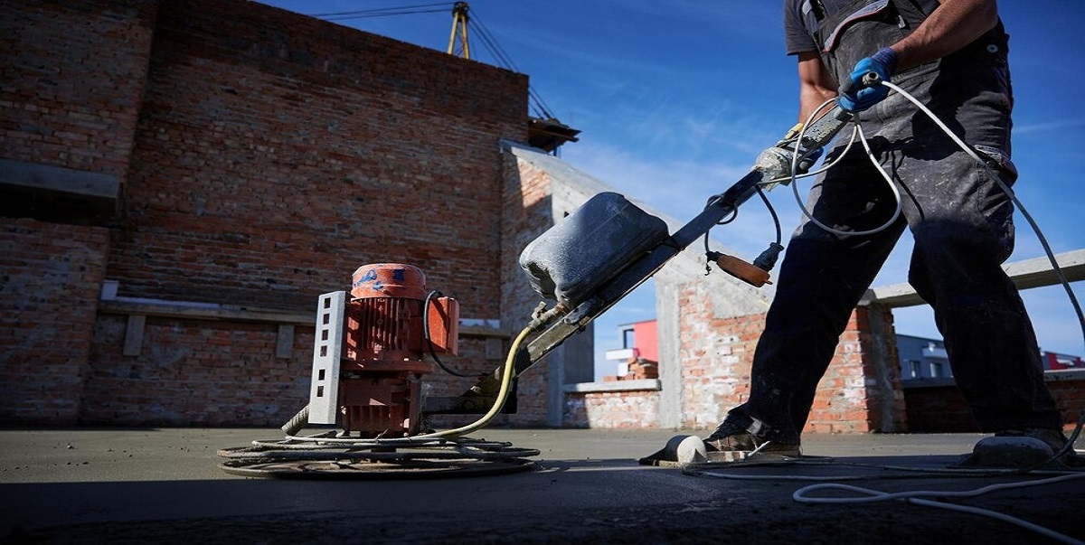 Man Cleaning Floor with Machine